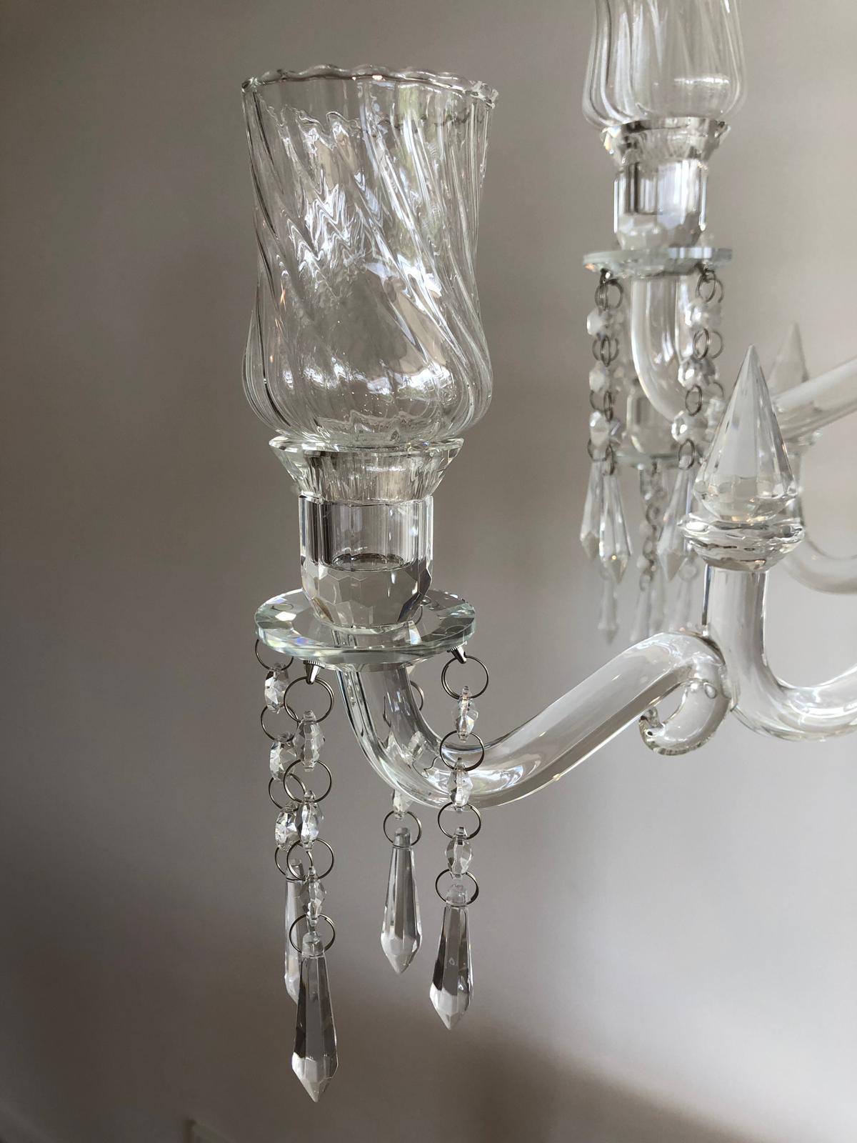 Elegant 9-head crystal candelabra standing 86cm tall, showcasing its intricate design and sparkling finish, perfect for weddings and events.