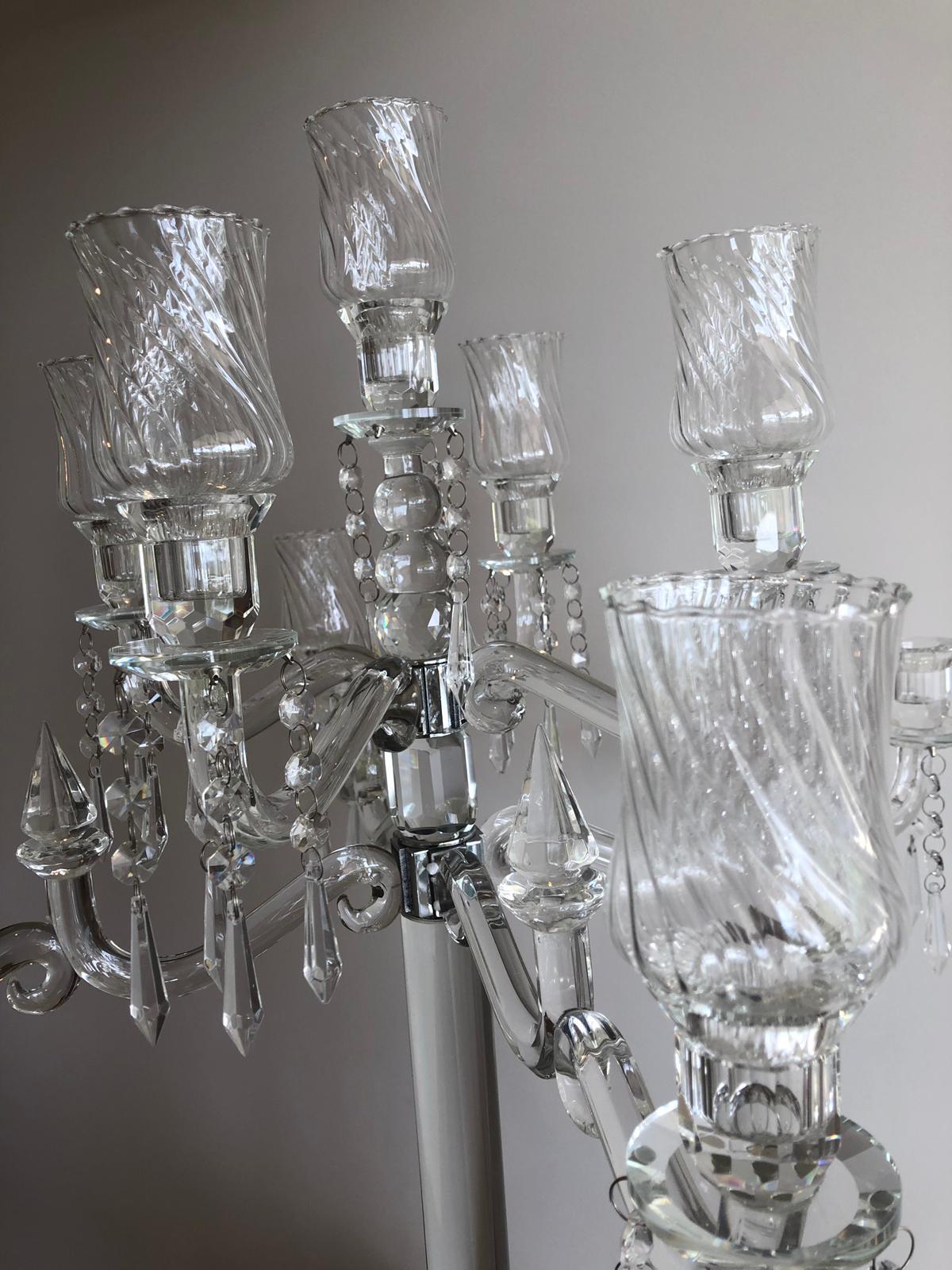 Elegant 9-head crystal candelabra standing 86cm tall, showcasing its intricate design and sparkling finish, perfect for weddings and events.