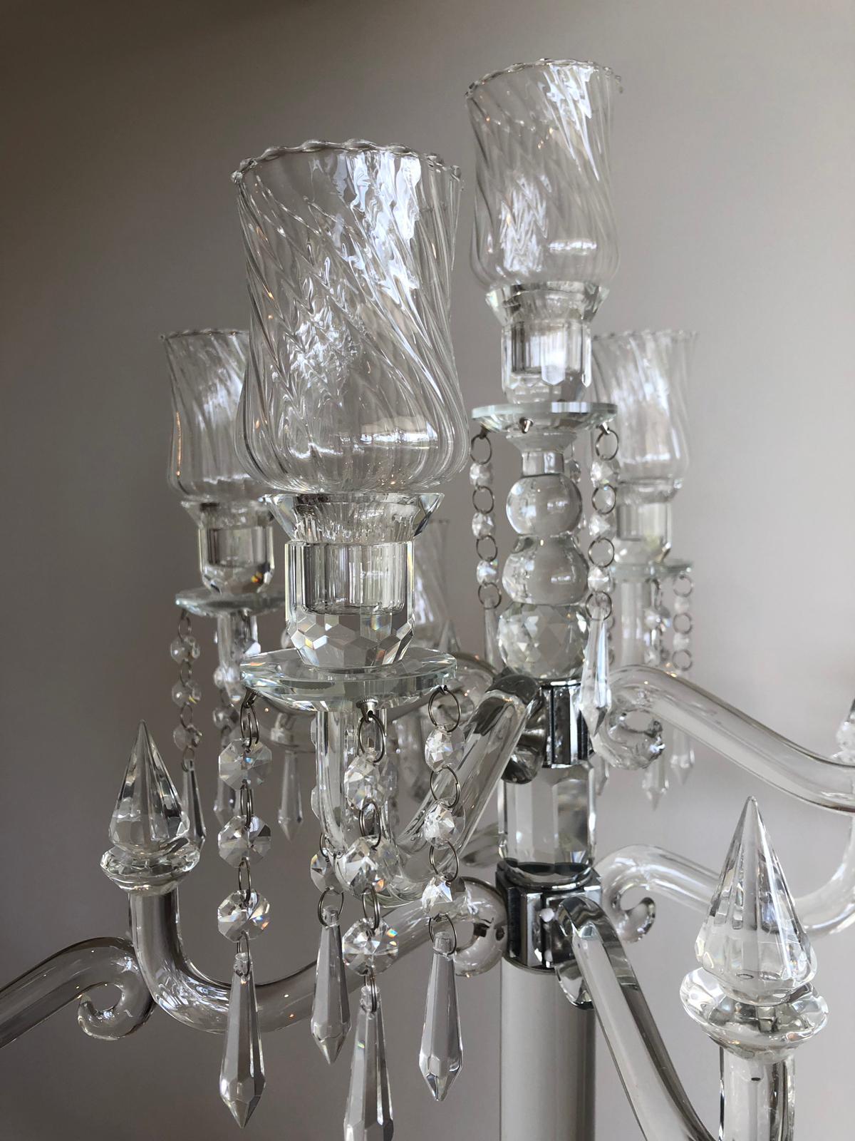 Elegant 9-head crystal candelabra standing 86cm tall, showcasing its intricate design and sparkling finish, perfect for weddings and events.