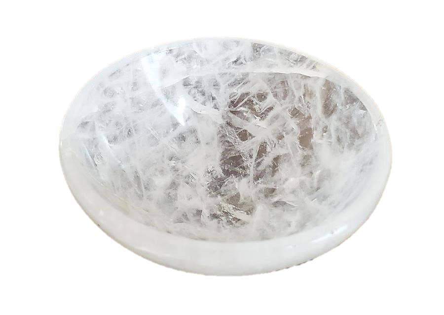 A polished crystal quartz gemstone bowl, 2 inches in diameter, showcasing its clear surface and natural variations.