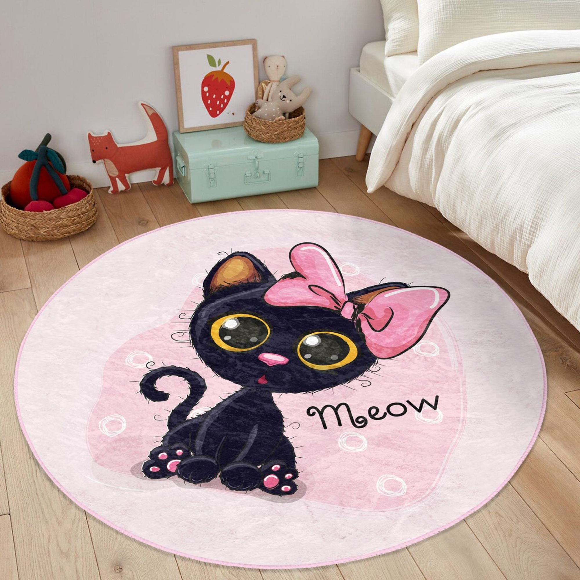 A soft, round rug featuring a cute pink kitty pattern, perfect for kids' rooms, showcasing vibrant colors and plush texture.