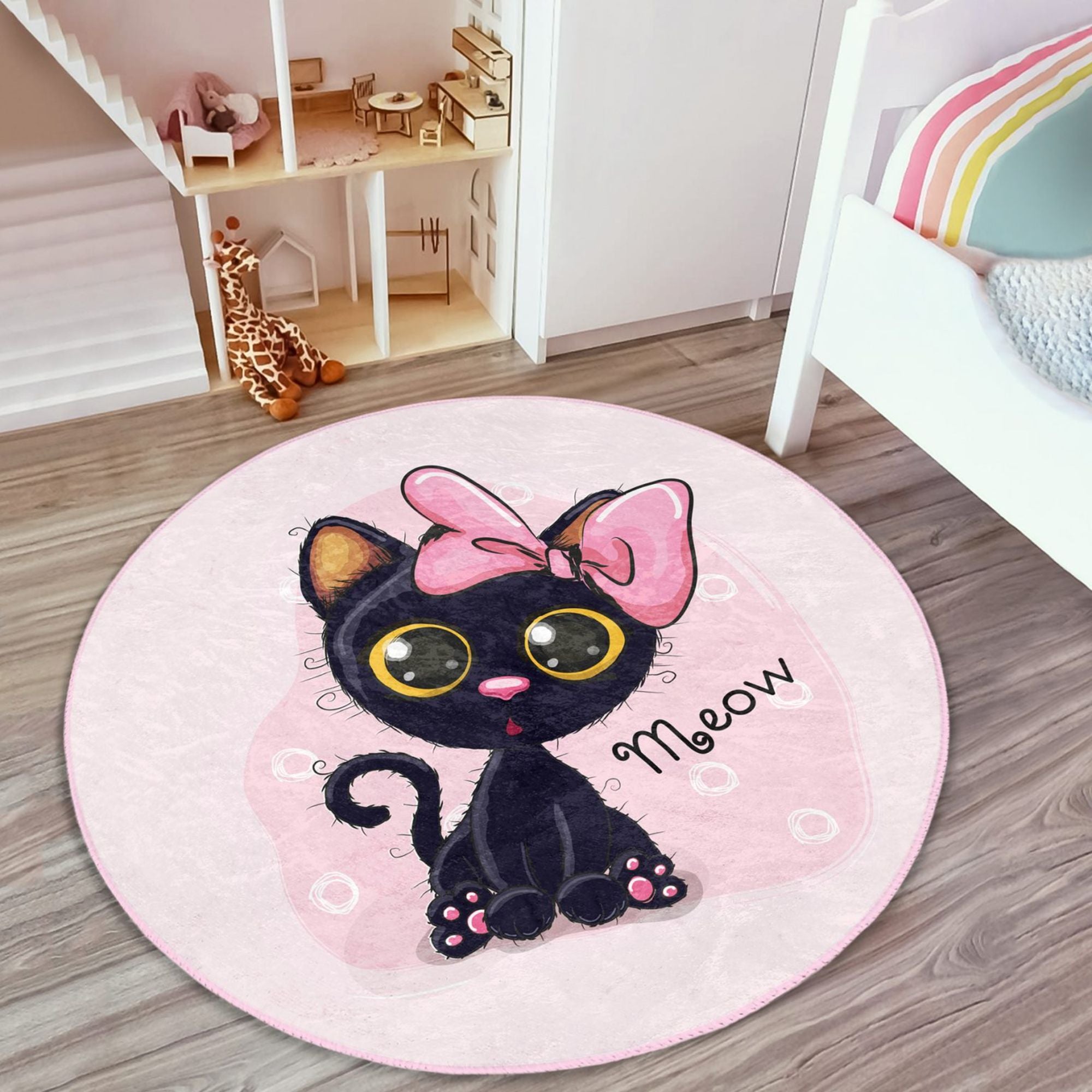 A soft, round rug featuring a cute pink kitty pattern, perfect for kids' rooms, showcasing vibrant colors and plush texture.