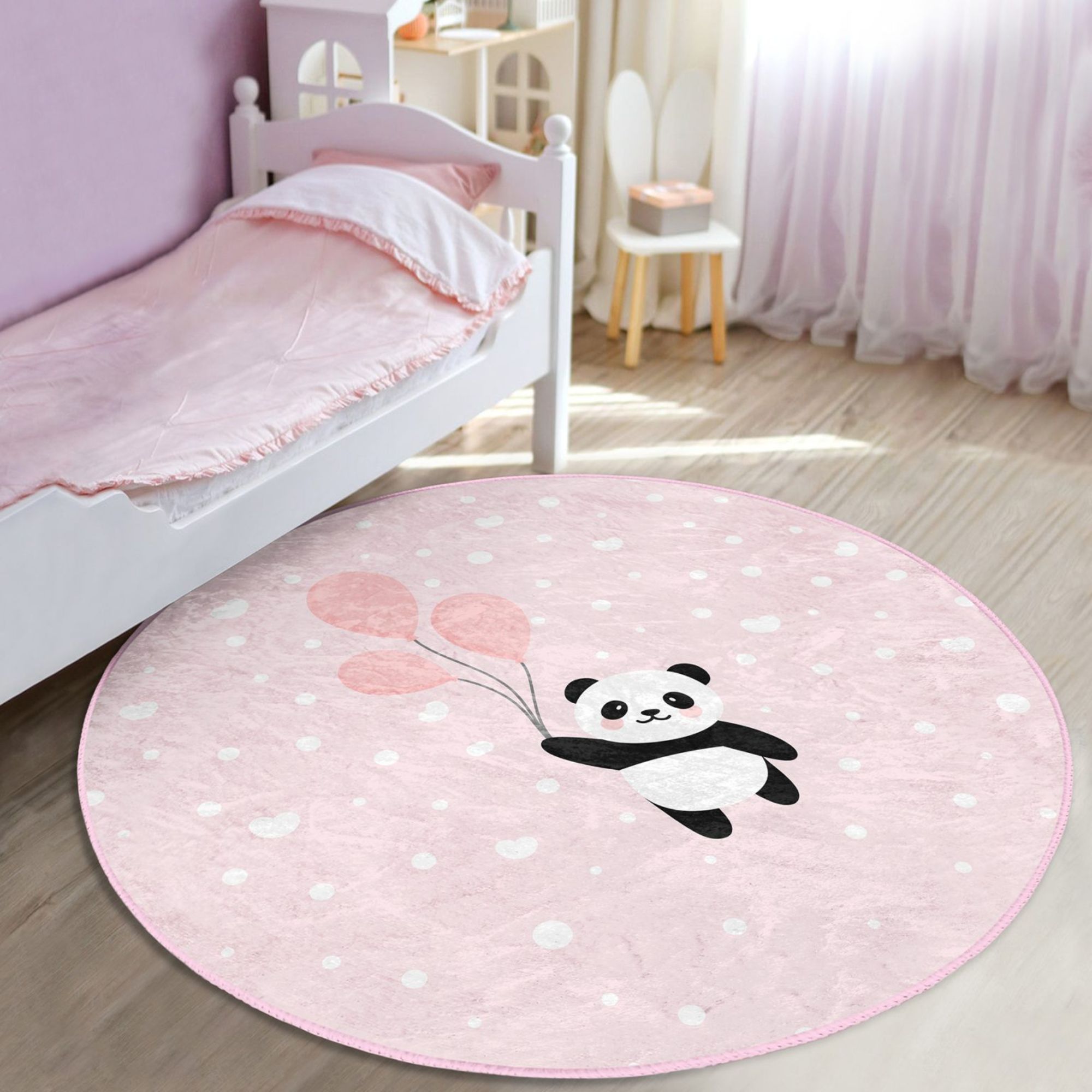 Cute pink rug featuring a panda with colorful balloons, perfect for girls' rooms, made from soft cotton material.