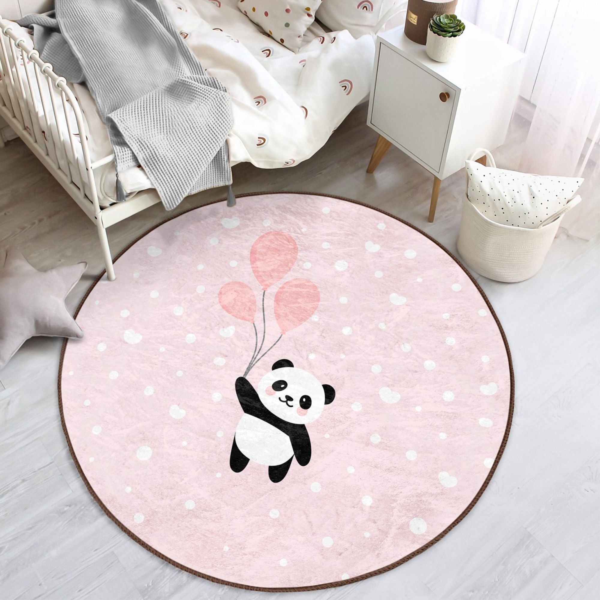 Cute pink rug featuring a panda with colorful balloons, perfect for girls' rooms, made from soft cotton material.