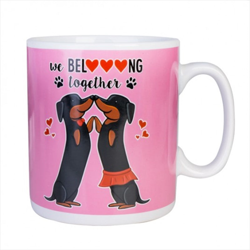 A large ceramic mug featuring two romantic dachshunds on a bright pink background, perfect for coffee lovers.