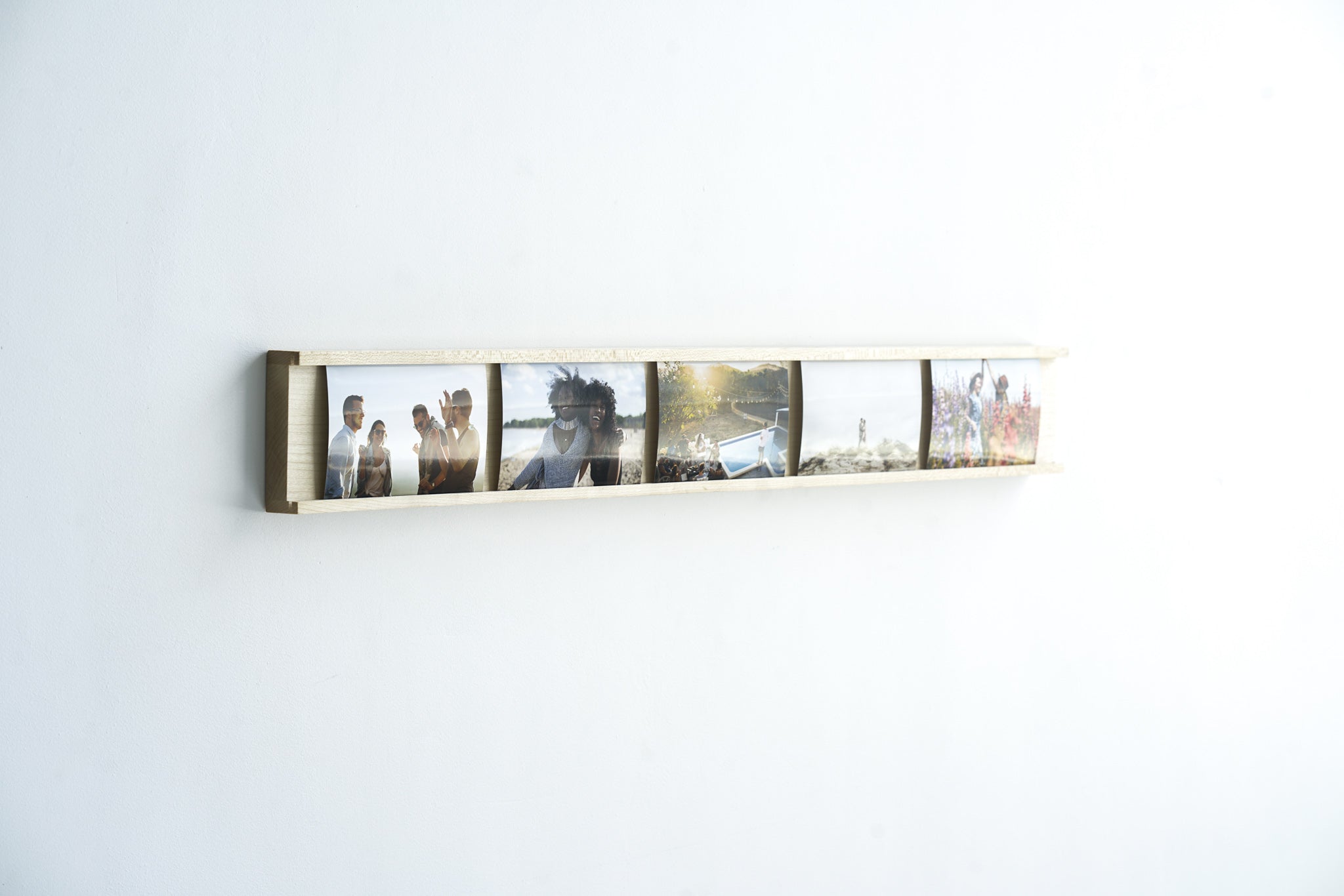 Daily Gallery Photo Bar Frame made of Maple hardwood, showcasing multiple 4x6 photos in a modern design.