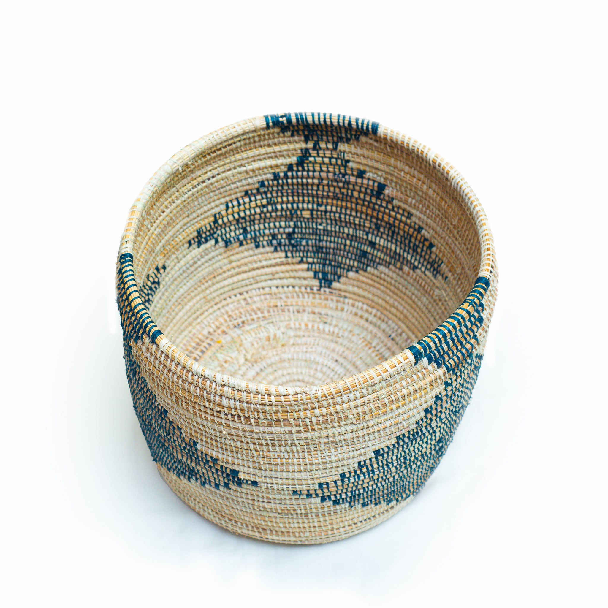 Darajani Handcrafted Basket showcasing vibrant colors and unique African weaving patterns, made from sustainable materials by skilled artisans.