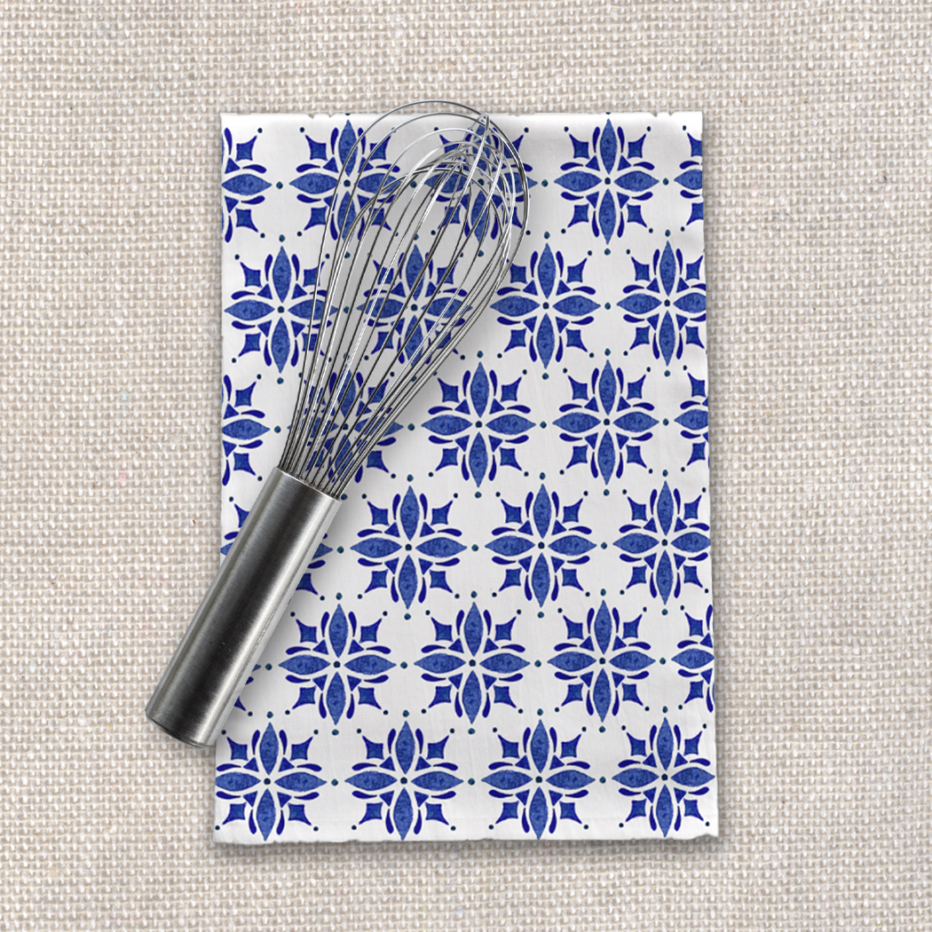 Dark blue tile tea towel made of cotton twill, featuring a charming design and hemmed edges, perfect for kitchen use.