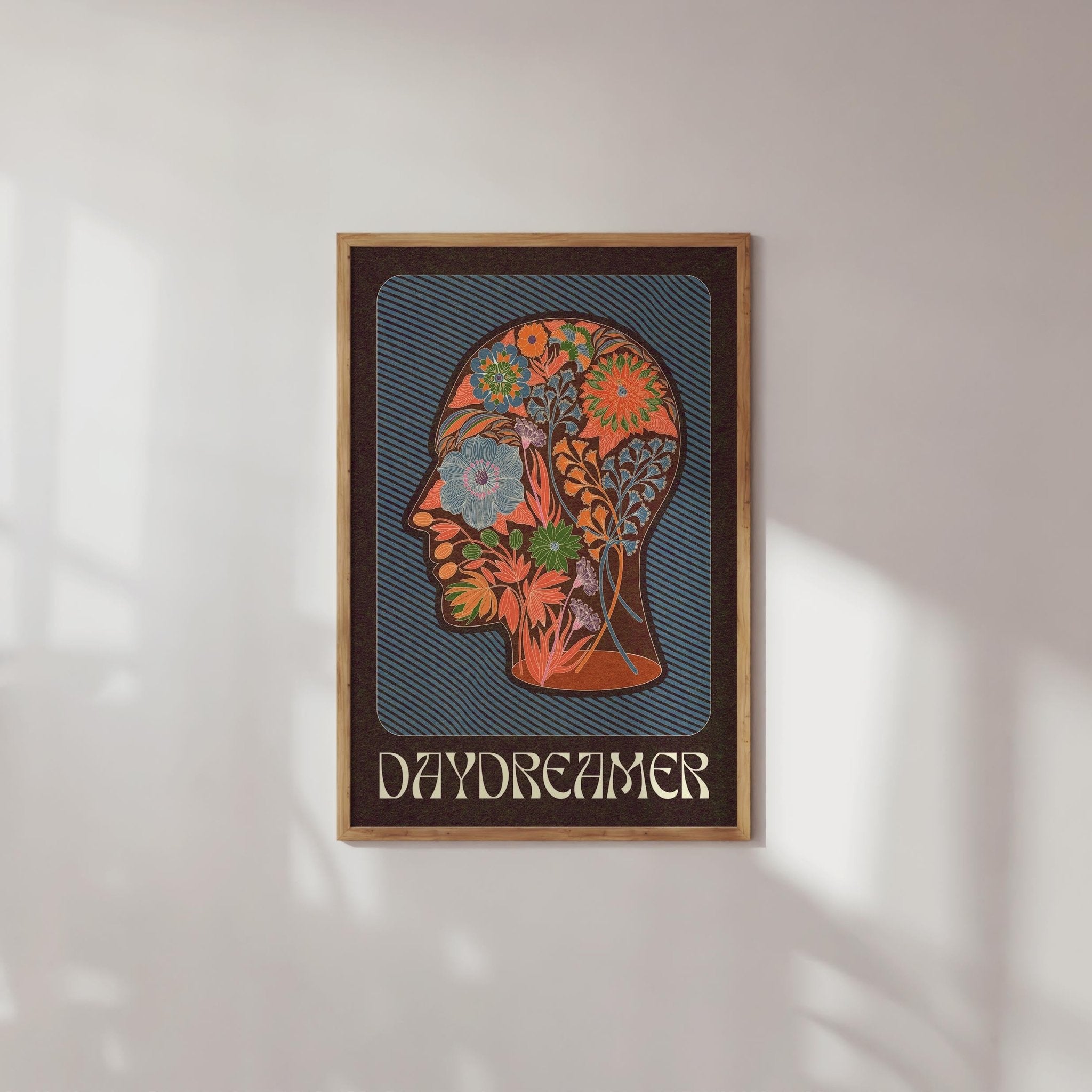 Daydreamer Art Print featuring a head silhouette filled with a boho floral pattern and the word 'Daydreamer' below.