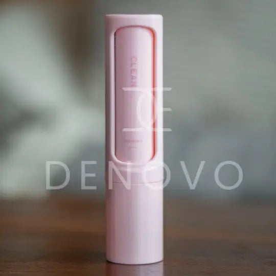 De Novo™ On-The-Go Lint Roller in a compact design, showcasing its self-cleaning feature and travel-friendly size.