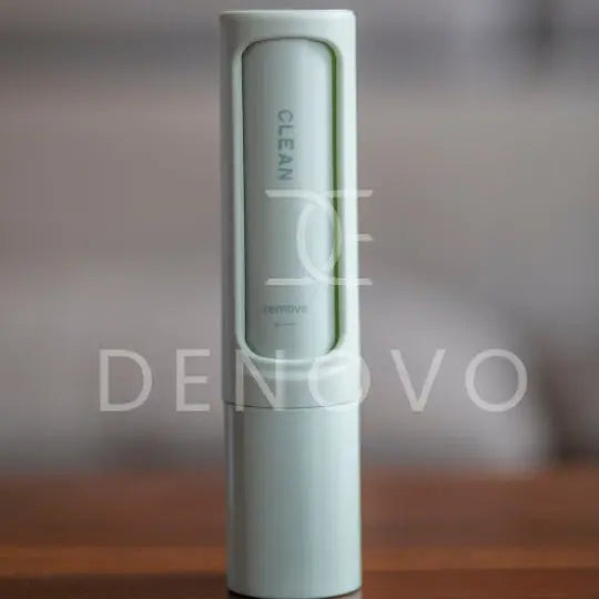 De Novo™ On-The-Go Lint Roller in a compact design, showcasing its self-cleaning feature and travel-friendly size.