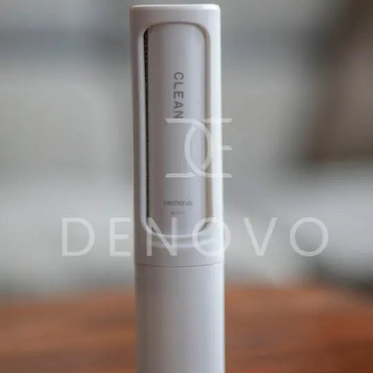 De Novo™ On-The-Go Lint Roller in a compact design, showcasing its self-cleaning feature and travel-friendly size.