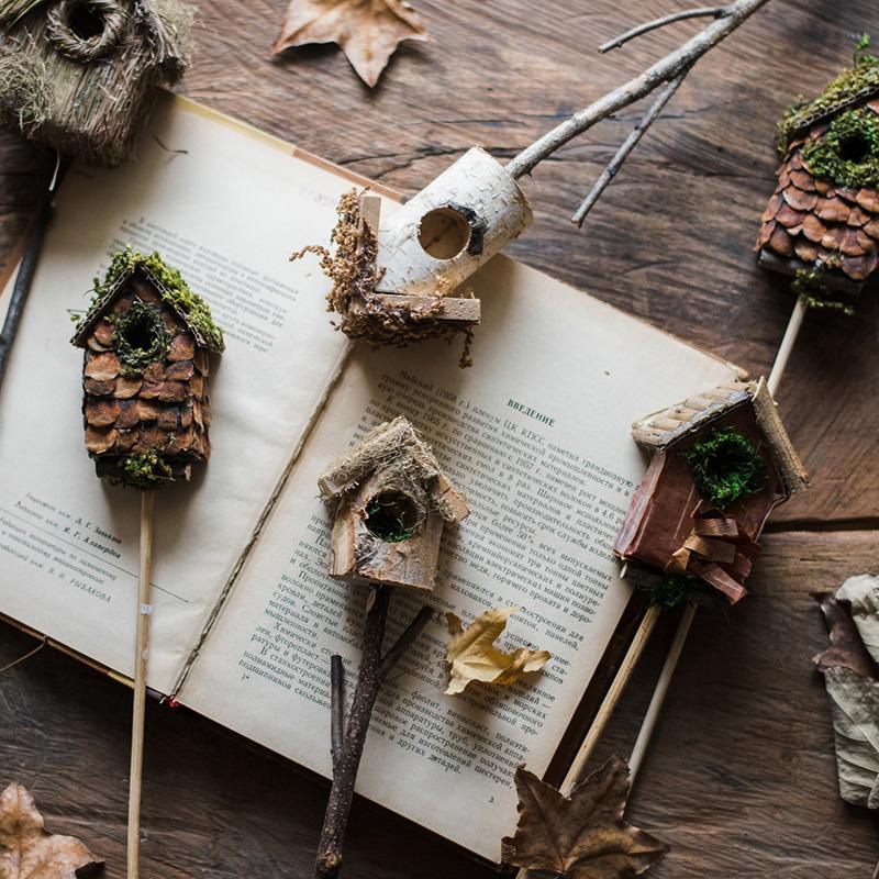 Set of 3 decorative bird house planter stakes in natural colors, showcasing unique designs made from organic materials.