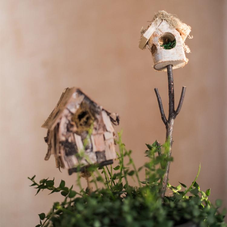 Set of 3 decorative bird house planter stakes in natural colors, showcasing unique designs made from organic materials.