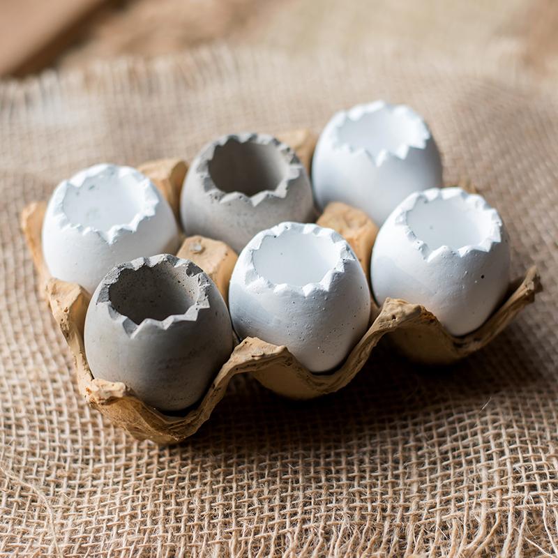 Decorative Eggshell Style Cement Planter in khaki and white colors, featuring a unique eggshell design, perfect for indoor decor.