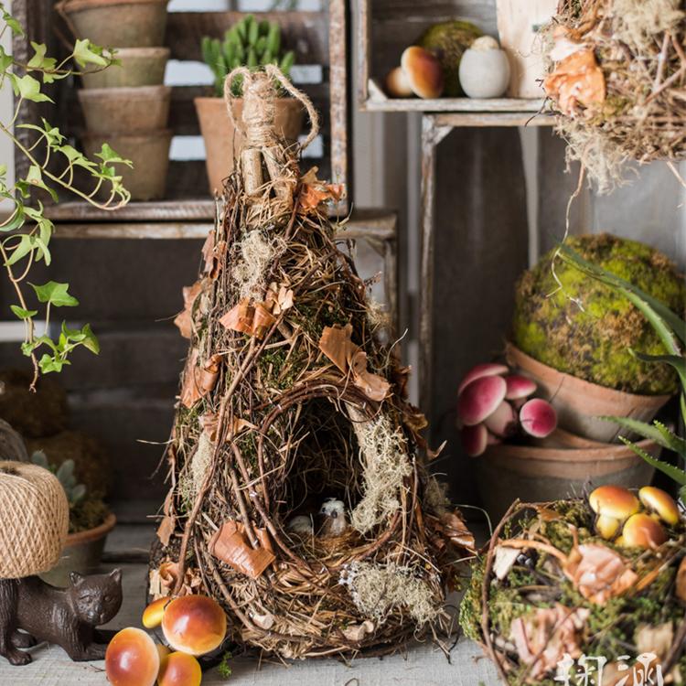 A beautifully crafted Decorative Natural Bird's Nest made from grass and willow, showcasing earthy tones of brown and green.