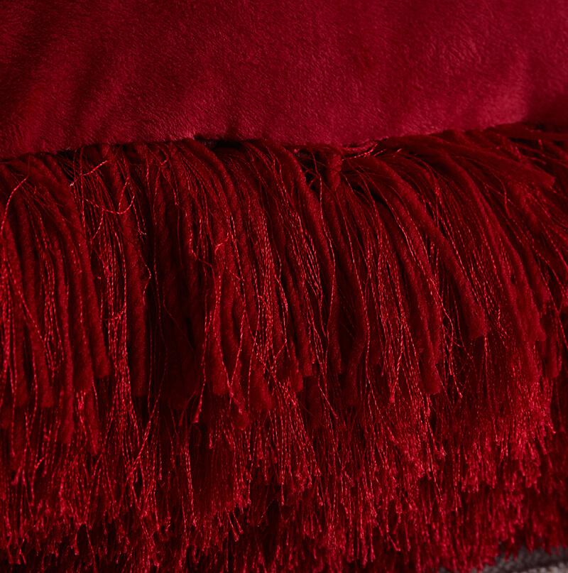 A cozy red decorative shaggy pillow, hand tufted, square shape, measuring 18 inches by 18 inches, perfect for home decor.