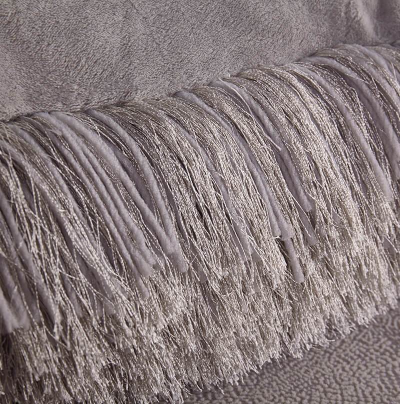 A cozy silver decorative shaggy pillow, hand tufted, measuring 18x18 inches, perfect for home decor.