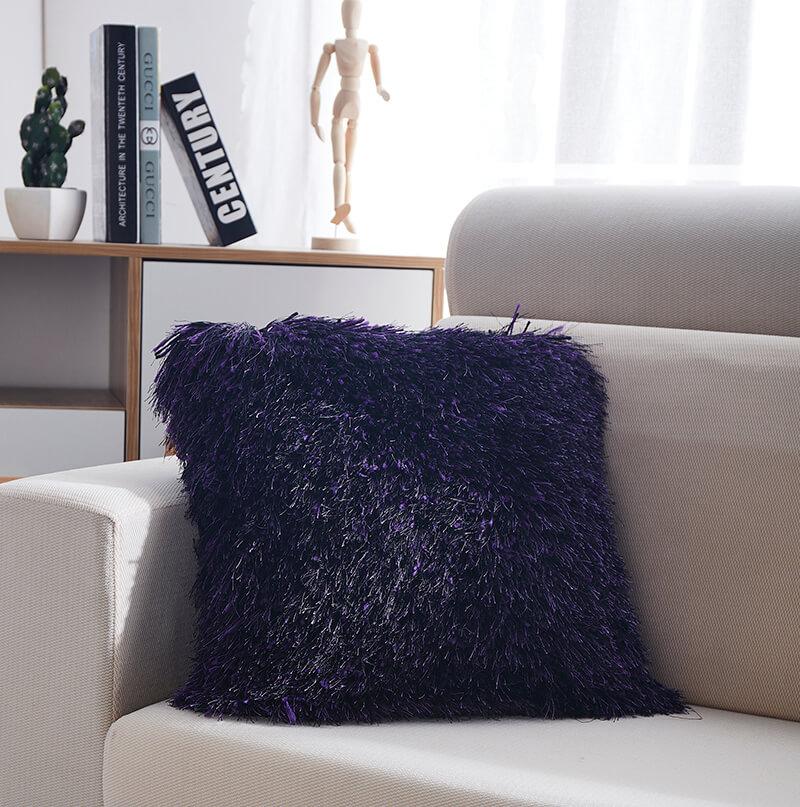 Decorative shaggy pillow in purple with lurex accents, featuring a plush texture and stylish design, perfect for home decor.