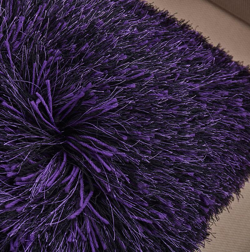 Decorative shaggy pillow in purple with lurex accents, featuring a plush texture and stylish design, perfect for home decor.