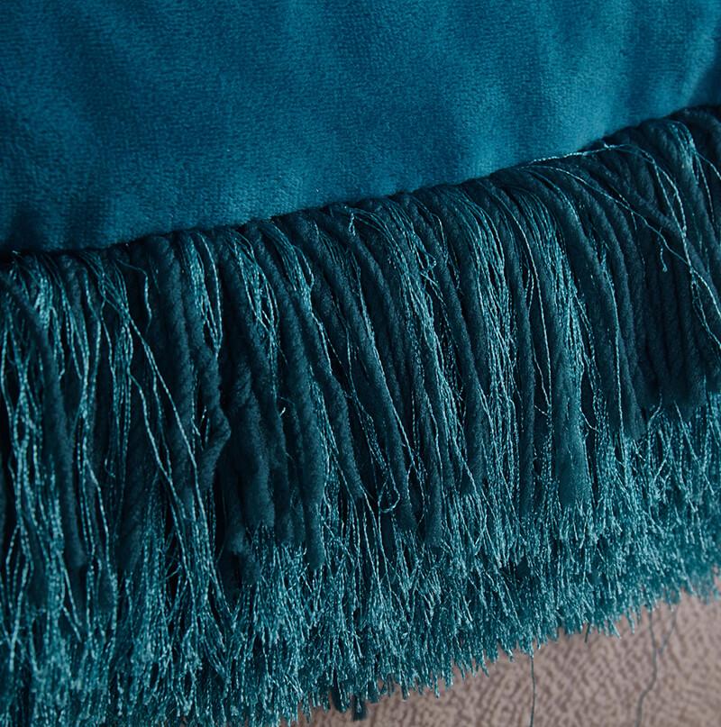 A cozy turquoise decorative shaggy pillow with Lurex detailing, hand tufted and square-shaped, measuring 18x18 inches.