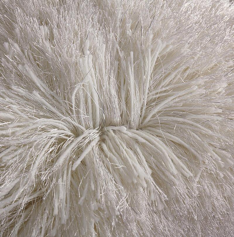 A cozy white decorative shaggy pillow with Lurex threads, hand tufted and square-shaped, measuring 18x18 inches.