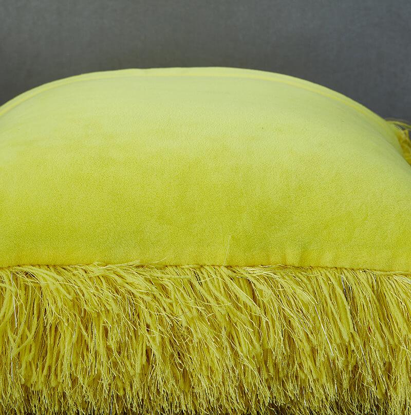 Decorative shaggy pillow in vibrant yellow with lurex threads, showcasing a retro modern design, perfect for adding glamour to any room.