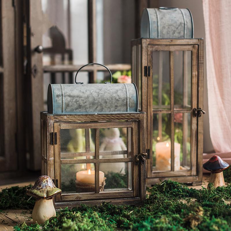 A beautifully crafted decorative table lantern made of wood and glass, featuring a rustic design with a candle inside, perfect for home decor.