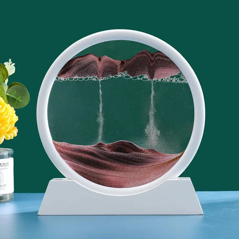 A beautiful 3D sand art piece depicting ocean waves, with layers of sand creating a mesmerizing effect, set in a round glass frame.