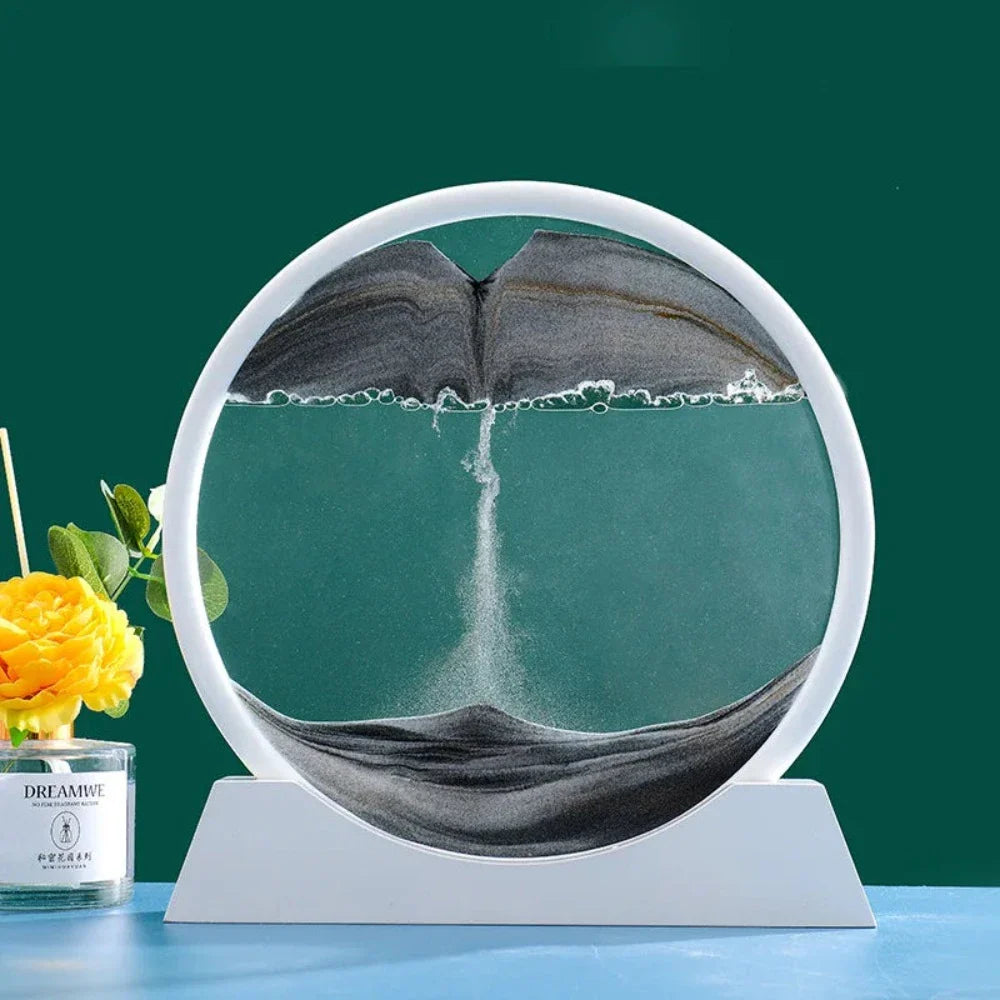 A beautiful 3D sand art piece depicting ocean waves, with layers of sand creating a mesmerizing effect, set in a round glass frame.