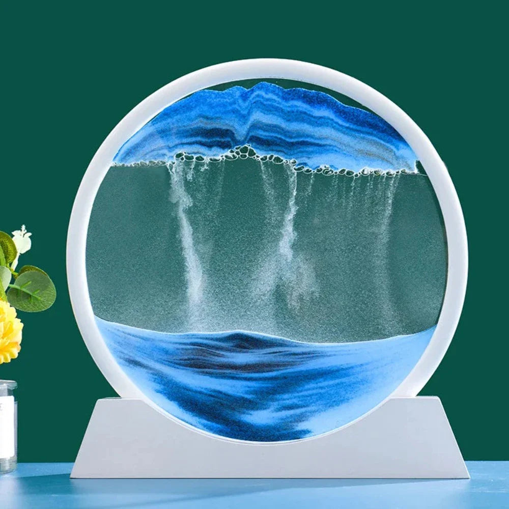 A beautiful 3D sand art piece depicting ocean waves, with layers of sand creating a mesmerizing effect, set in a round glass frame.