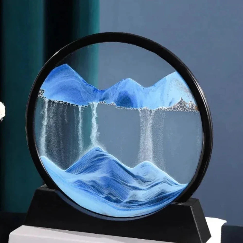 A beautiful 3D sand art piece depicting ocean waves, with layers of sand creating a mesmerizing effect, set in a round glass frame.