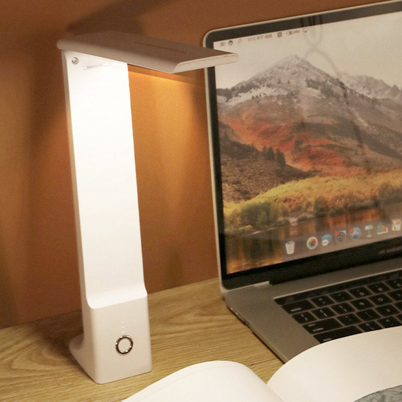 ANDREE rechargeable LED desk lamp in white, featuring adjustable arm and touch switch for light intensity and hue.