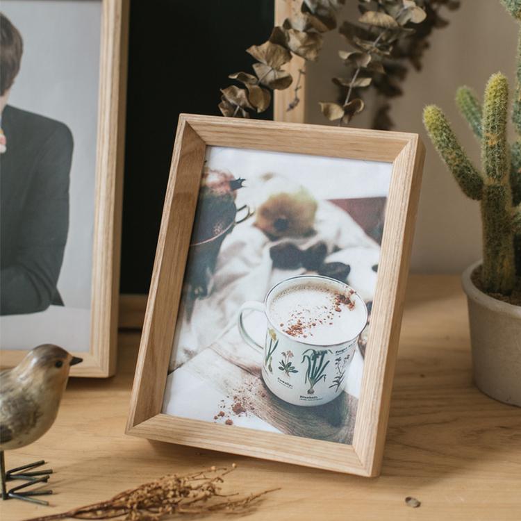 A handcrafted Desktop Solid Wood Photo Frame made from North American White Ash, showcasing a photo in a natural finish.