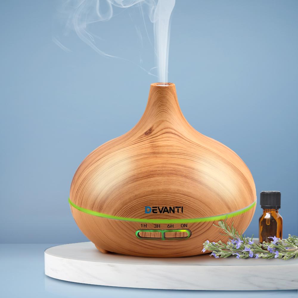 Devanti 300ml 4-in-1 Aroma Diffuser in light wood finish, showcasing its elegant design and LED light features.