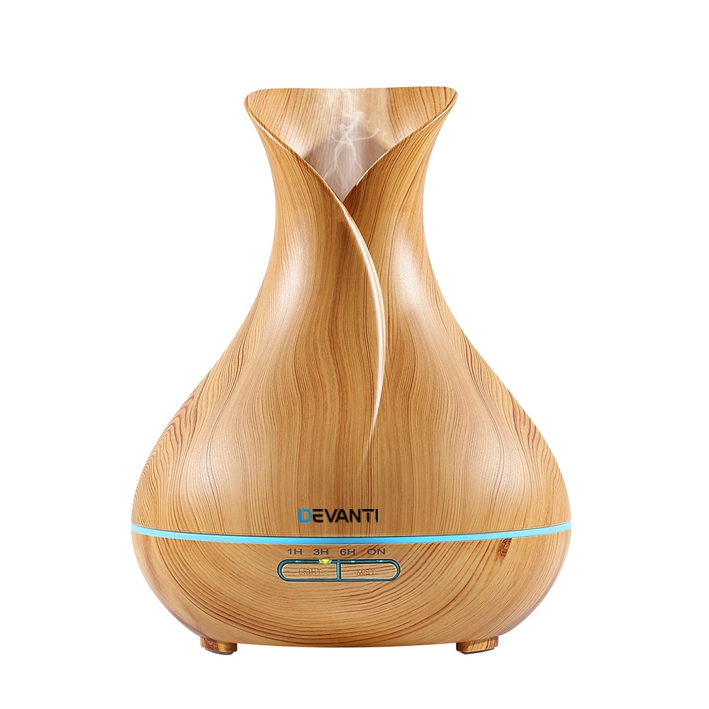 Devanti 400ml 4-in-1 Aroma Diffuser in light wood finish, showcasing its elegant design and remote control feature.