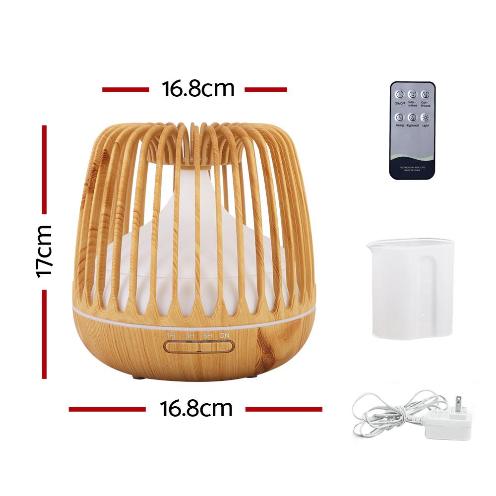 Devanti 4-In-1 Aroma Diffuser with wood grain design, showcasing its ultrasonic mist and LED night light features.