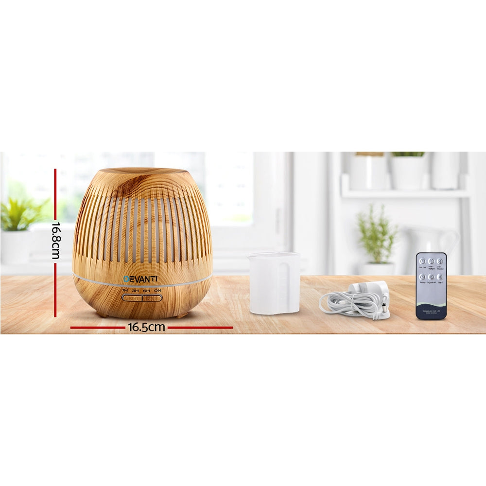 Devanti Aromatherapy Diffuser with wood grain design, LED lights, and remote control, showcasing its elegant and multifunctional features.