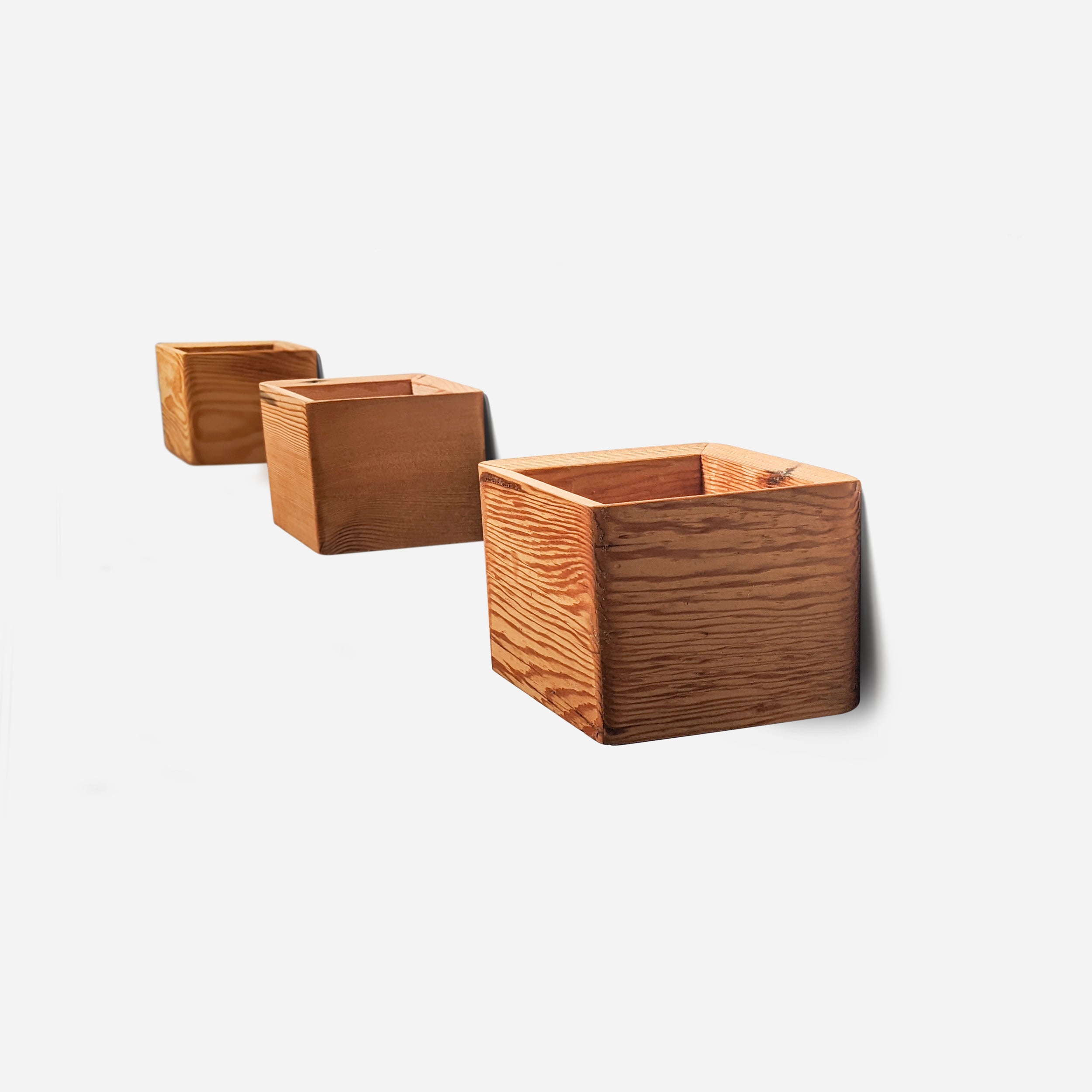 Diamond self-watering wall-mounted planter in wood, showcasing its unique shape and natural finish options.