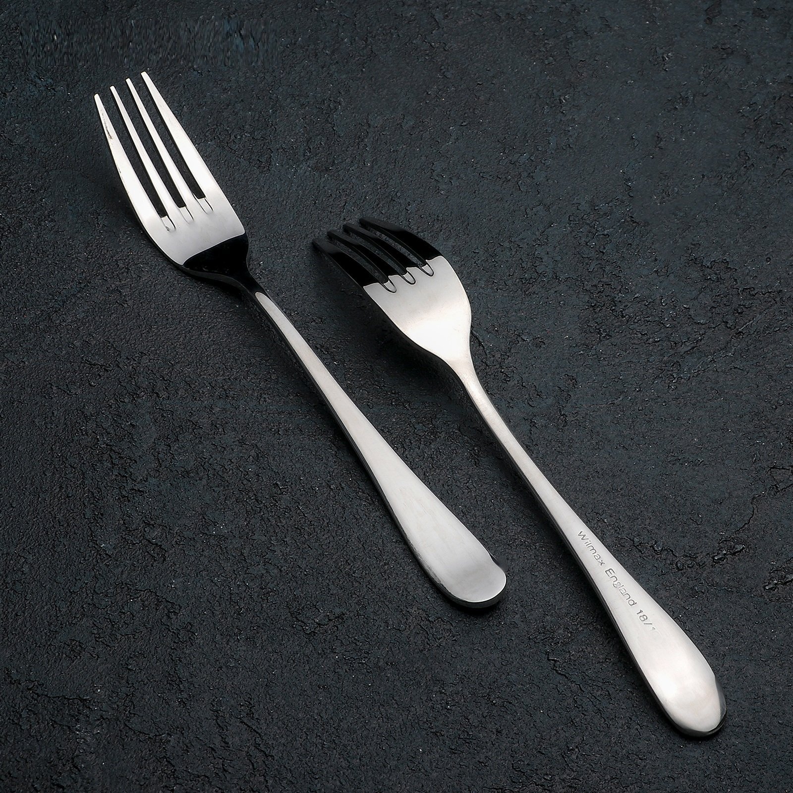 WILMAX 8 inch dinner fork made of high polish stainless steel, showcasing its elegant design and smooth texture.