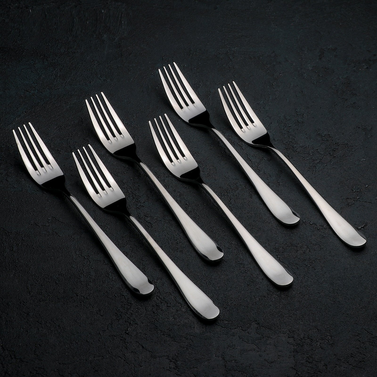 WILMAX 8 inch dinner fork made of high polish stainless steel, showcasing its elegant design and smooth texture.