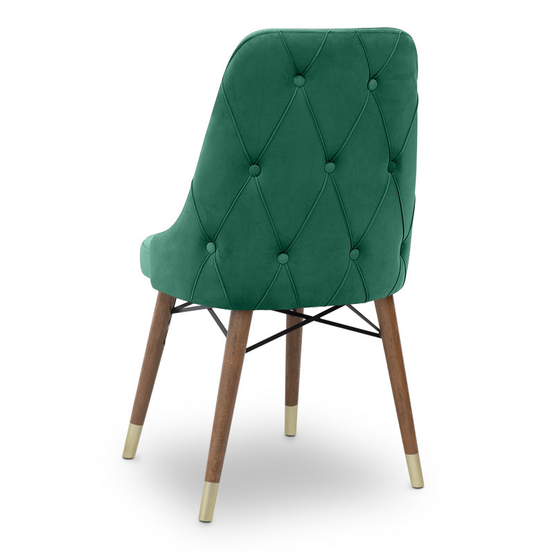 EDMOND velvet dining chair in dark green with walnut and gold legs, showcasing luxurious upholstery and elegant design.