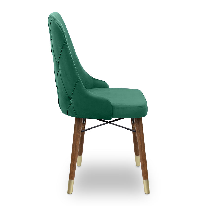 EDMOND velvet dining chair in dark green with walnut and gold legs, showcasing luxurious upholstery and elegant design.