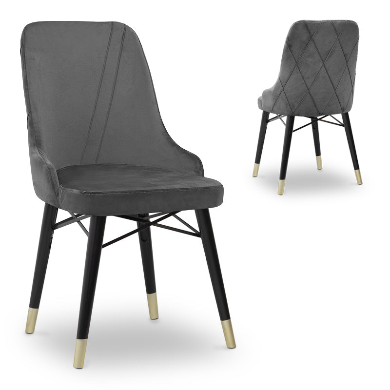 MARK velvet grey dining chair with black and gold legs, showcasing its luxurious design and plush upholstery.