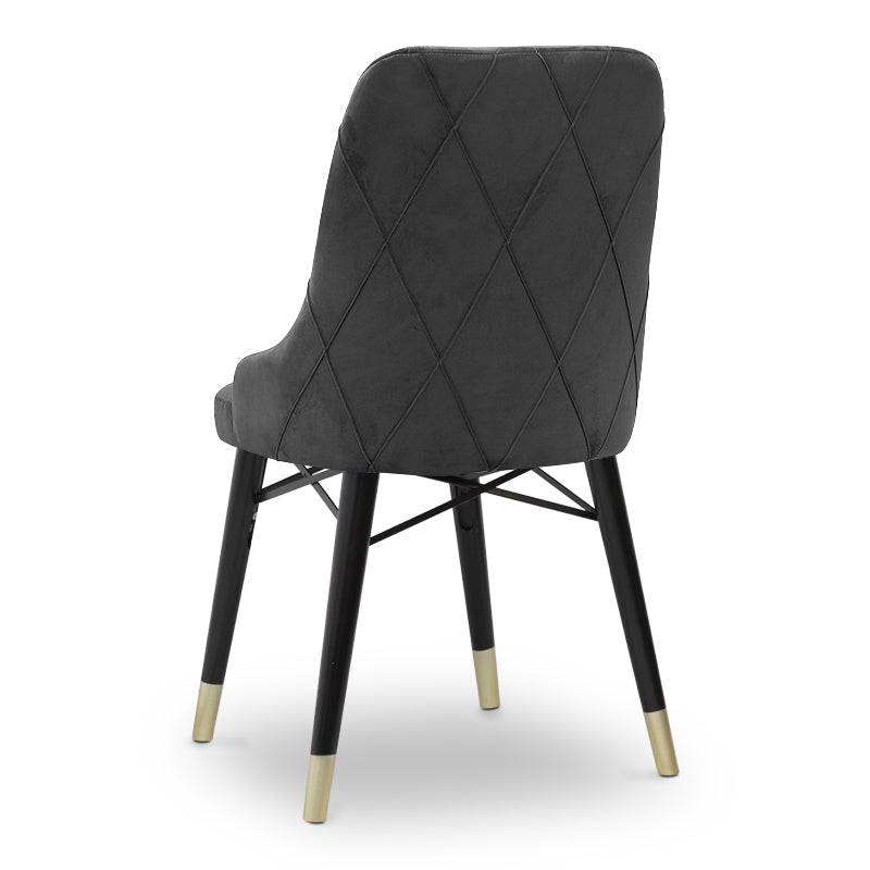 MARK velvet grey dining chair with black and gold legs, showcasing its luxurious design and plush upholstery.