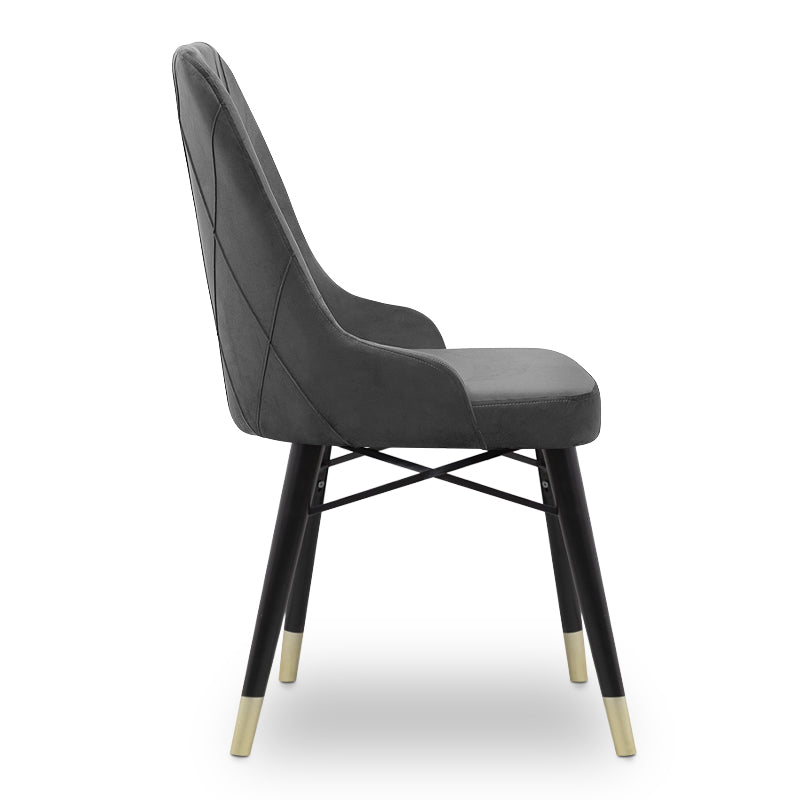 MARK velvet grey dining chair with black and gold legs, showcasing its luxurious design and plush upholstery.