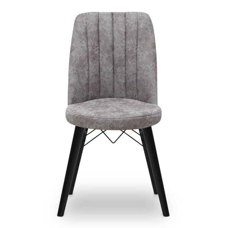 RALU velvet dining chair in grey with black wooden legs, showcasing its elegant design and plush upholstery.