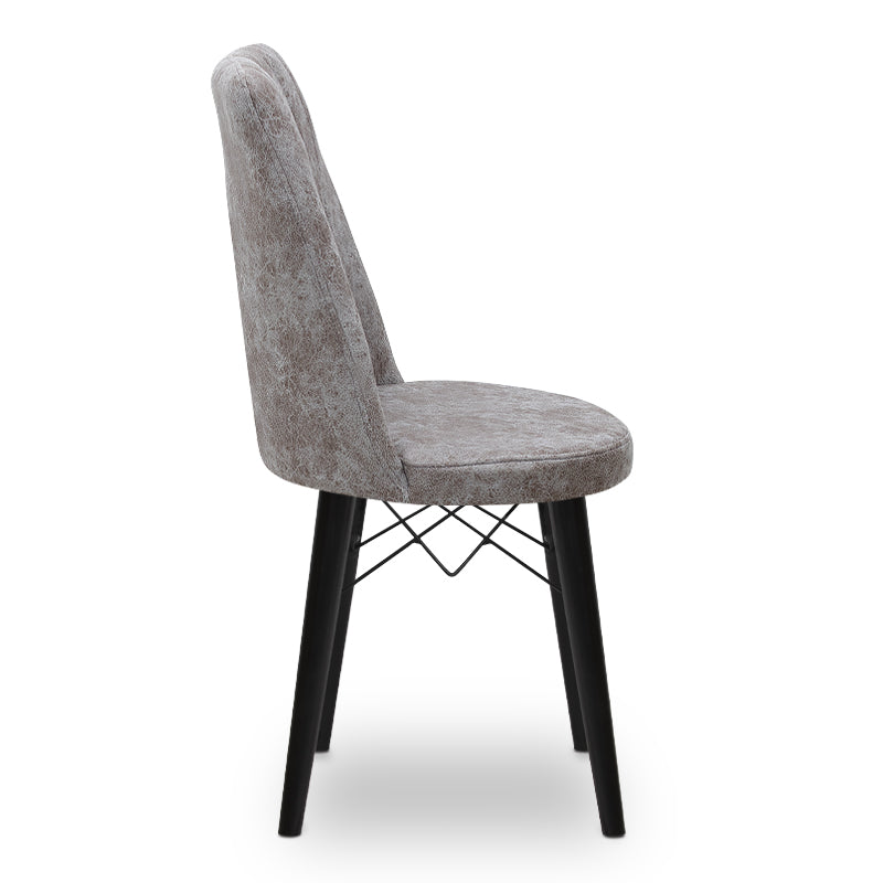 RALU velvet dining chair in grey with black wooden legs, showcasing its elegant design and plush upholstery.