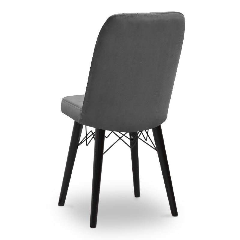 ALFONSO Grey velvet dining chair with black legs and gold detailing, showcasing luxury and elegance.