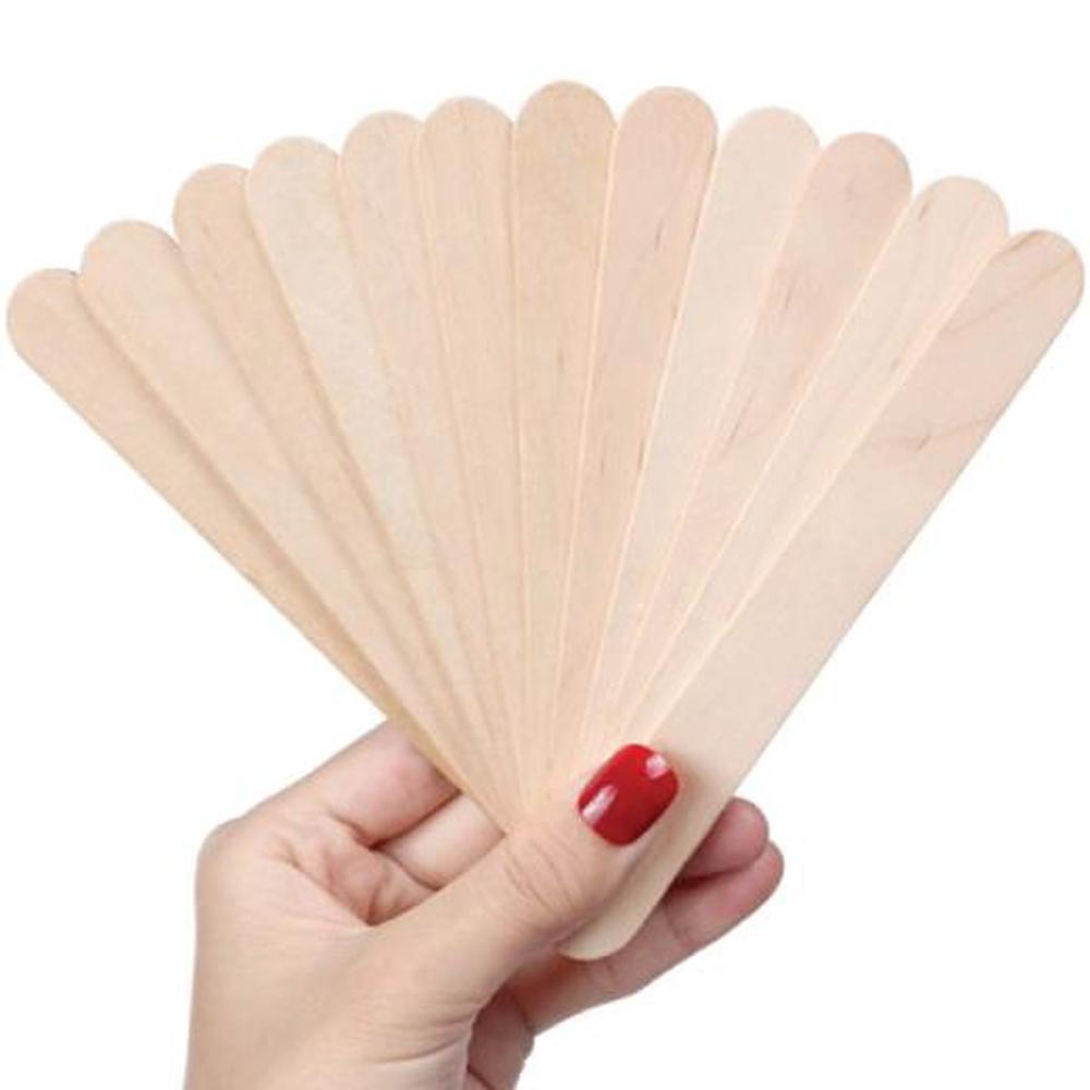 A pack of disposable wooden tongue depressors, 6 inches long, ideal for waxing and medical use, showcasing their smooth finish and eco-friendly material.